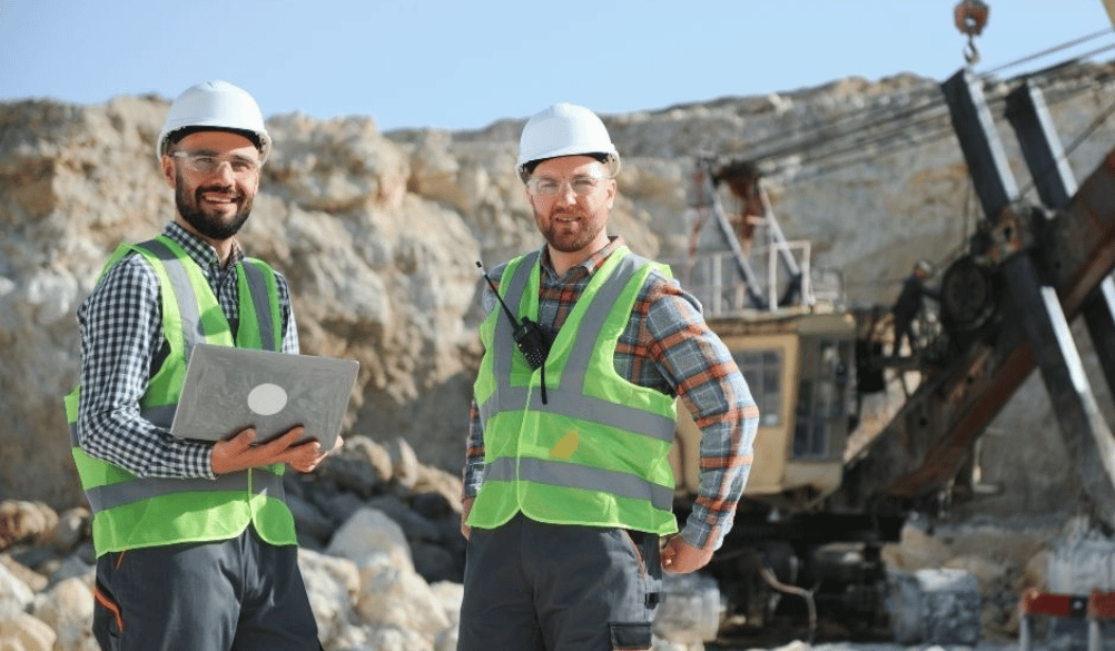 two employees working on laptop