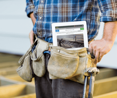 construction worker with training on ipad in the field